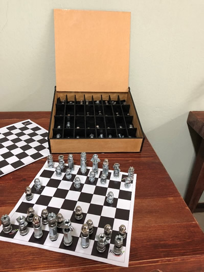 A Chess set made from nuts and bolts, by children of Komati Estate